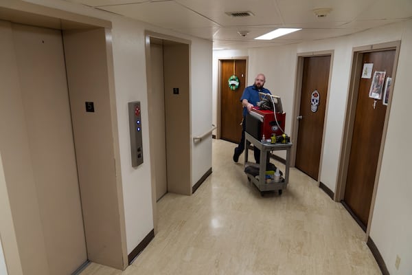 James Richardson walks to the elevator while doing repairs in Smith Tower Apartments on Monday, March 10, 2025, in Vancouver, Wash. (AP Photo/Jenny Kane)