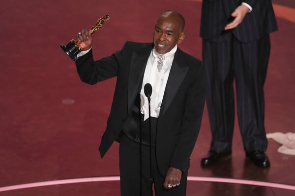 Paul Tazewell accepts the award for best costume design for "Wicked" during the Oscars on Sunday, March 2, 2025, at the Dolby Theatre in Los Angeles. (AP Photo/Chris Pizzello)