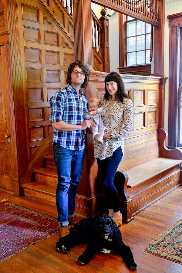 Nicholas and Elliott Niespodziani moved into their midtown Atlanta Victorian home in 2013. Nicholas’ father, Ed, handled much of the renovation, and designers Amanda Whitaker and Elliott’s mother, Ruthie Watts, helped make the fixer upper a home. Daughter Emmylou was born in January 2016. Nicholas is a singer, musicians, and owner and partner in Venkman’s restaurant in the Old Fourth Ward; Elliott is a senior publicist for Adult Swim. Text by Lori Johnston and Keith Still/Fast Copy News Service. (Christopher Oquendo Photography/www.ophotography.com)