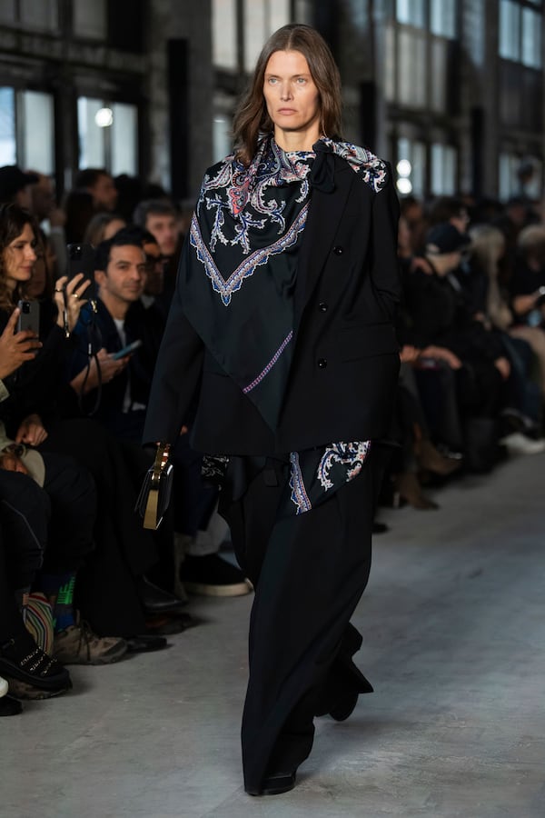 A model wears a creation as part of the Sacai Fall/Winter 2025-2026 Womenswear collection presented in Paris, Monday, March 10, 2025. (Photo by Scott A Garfitt/Invision/AP)