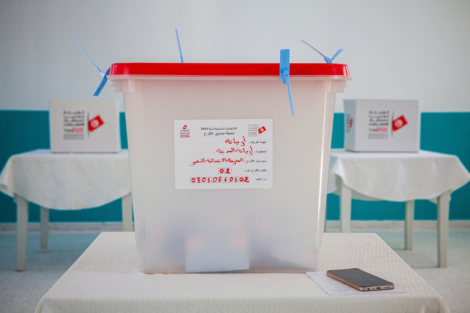 Ballot boxes inside a polling station during the presidential elections, in the capital Tunis, Tunisia, Sunday, Oct. 6, 2024 (AP Photo/Ons Abid)