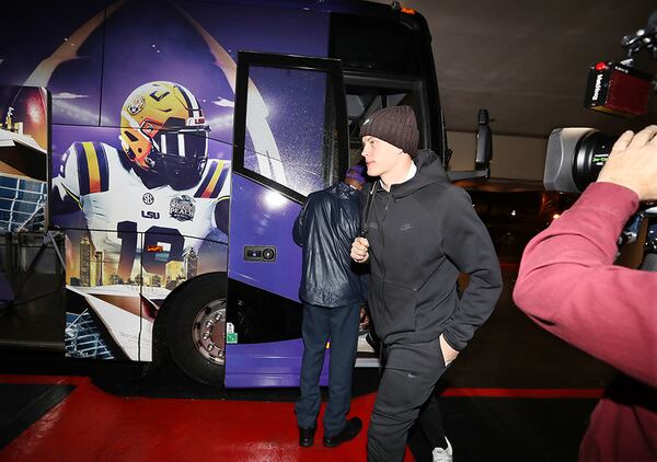 LSU quarterback Joe Burrow, the 2019 Heisman Trophy winner, arrives Sunday, Dec. 22, 2019, in Atlanta with his team for the week of preparations before the Chick-fil-A Peach Bowl.