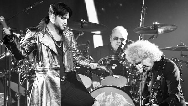 (L-R) Singer Adam Lambert, drummer Roger Taylor and guitarist Brian May of Queen + Adam Lambert perform. They have been tapped to portray at the Oscars this year.