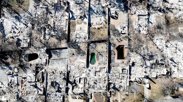 FILE - Residences destroyed by the Eaton Fire line a neighborhood in Altadena, Calif., Jan. 21, 2025. (AP Photo/Noah Berger, File)