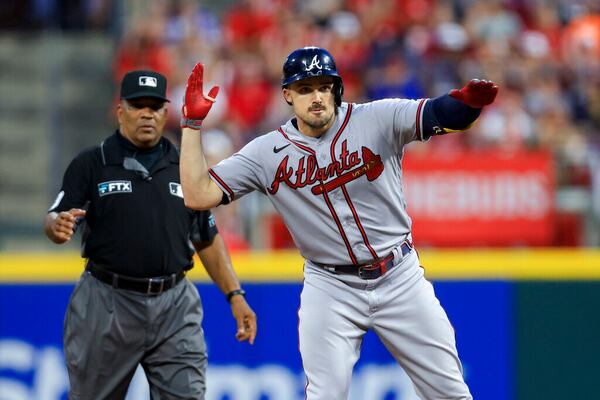 Atlanta Braves' Adam Duvall gestures after hitting an RBI double during the eighth inning of the team's baseball game against the Cincinnati Reds in Cincinnati, Friday, July 1, 2022. The Braves won 9-1. (AP Photo/Aaron Doster)