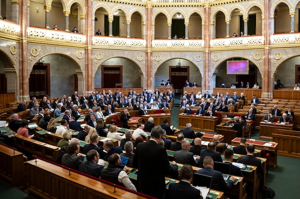 Representatives vote during the plenary session of the Hungarian parliament in Budapest, Hungary, Tuesday, March 18, 2025. (Boglarka Bodnar/MTI via AP)