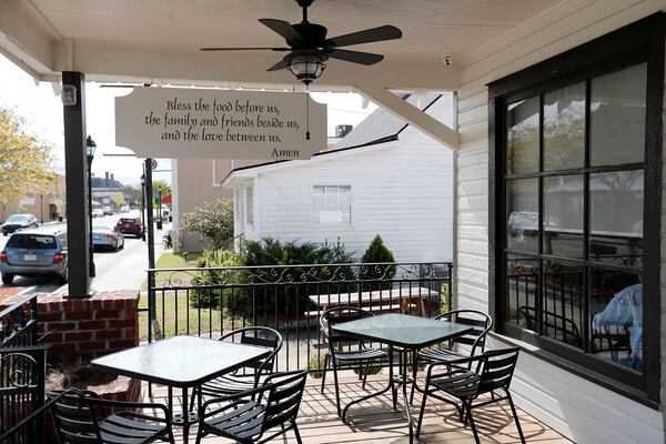 A prayer hangs over the outdoor seating area at Central Station in Springfield.