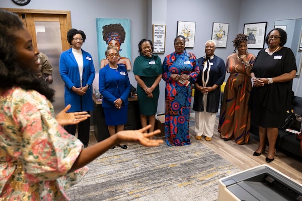 Mariama Keita-Thiero, far left, gives some last minute instructions before an event to celebrate Black women mayors from local cities in College Park on Wednesday, Feb. 28, 2024. Shown from left are Bianca Motley Broom from College Park, Rochelle Robinson from Douglasville, Beverly Burks from Clarkston, Angelyne Butler from Forest Park, Marci Fluellyn from Lovejoy, Teresa Thomas Smith from Palmetto and Sandra Vincent from McDonough.  (Ben Gray / Ben@BenGray.com)