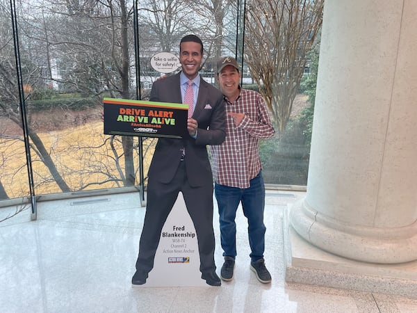 WSB Radio host Mark Arum poses with his cardboard TV buddy Fred Blankenship.