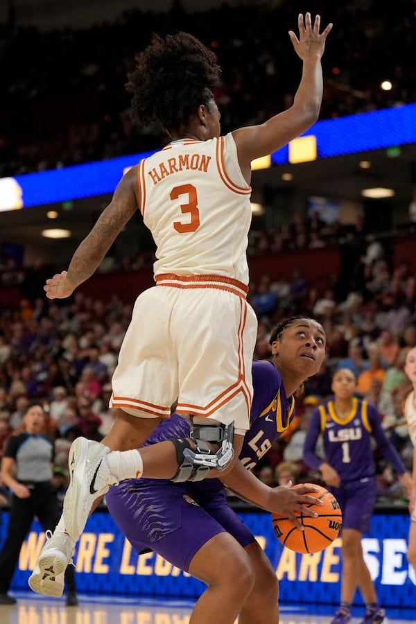 Texas guard Rori Harmon guards LSU guard Mikaylah Williams during the first half during of an NCAA college basketball game in the semifinals of the Southeastern Conference tournament, Saturday, March 8, 2025, in Greenville, S.C. (AP Photo/Chris Carlson)