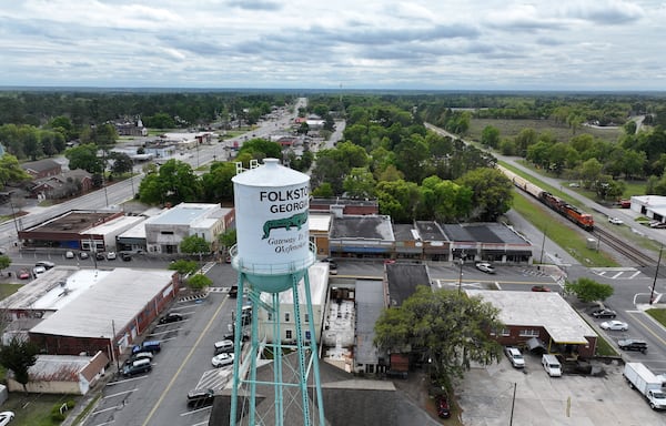 Drone photograph shows the water tank in downtown Folkston, Monday, Mar. 18, 2024. Last month, the Georgia Environmental Protection Division (EPD) released draft permits to Twin Pines Minerals for a 584-acre mine that would extract titanium and other minerals from atop the ancient sand dunes on the swamp’s eastern border, which holds water in the refuge. (Hyosub Shin / Hyosub.Shin@ajc.com)