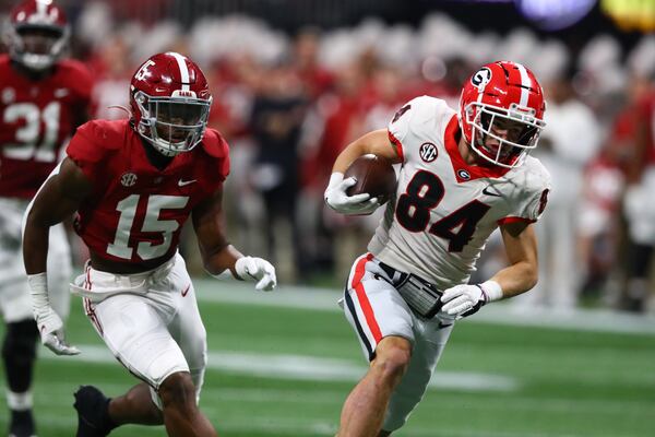 Georgia Bulldogs wide receiver Ladd McConkey (84) breaks away for a touchdown after a 32-yard reception in the second quarter of the  SEC Championship football game between the Georgia Bulldogs and the Alabama Crimson Tide.   Curtis Compton / Curtis.Compton@ajc.com 