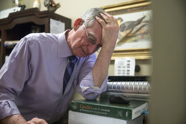 10/24/2019 — Augusta, Georgia — Dr. John Downey reacts after Physician Assistant Corinne Wilson goes over a patient that is “pushing the rules” during their visit at the Royal Pain Center in Augusta, Thursday, October 24, 2019. Dr. Downey says that if a patient breaches the offices agreement, he and his staff will give the patient 30 days of pharmaceutical pain treatment, which gives them time to find another medical practice for pain treatment. (Alyssa Pointer/Atlanta Journal Constitution)