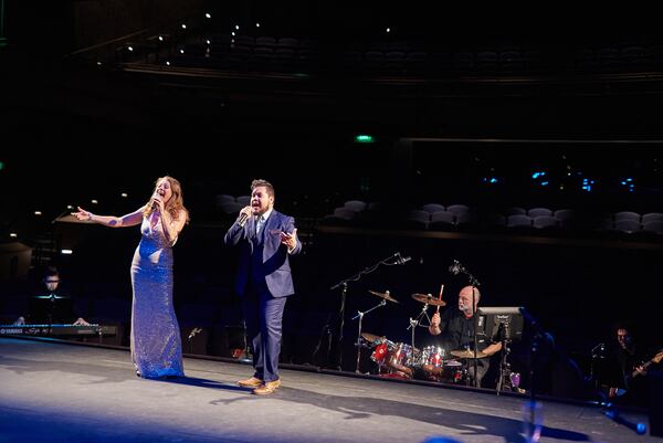 Kristin Markiton (left) and Juan Unzueta perform at the grand opening of the Lawrenceville Arts Center.
Photo by Chris Bartelski