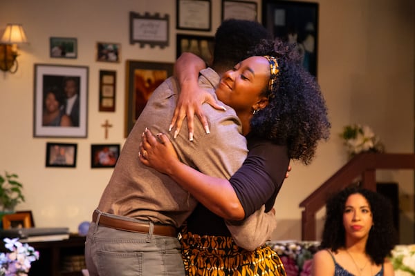 Evy (Irene Polk, center) embraces her brother, Jesse (Jason Jamal Ligon), while leaving her half-sister Ronnie (Catherine Campbell) unacknowledged.