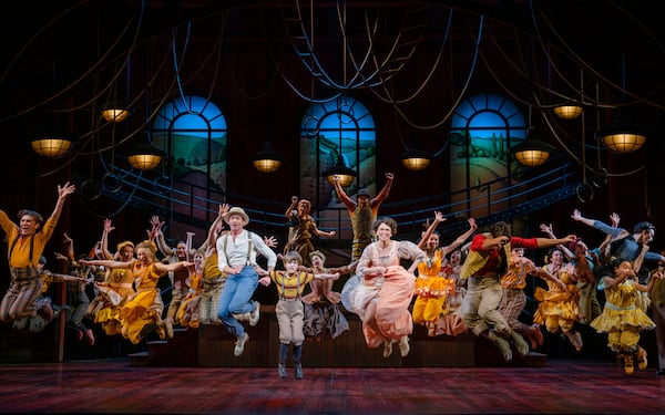 Hugh Jackman and Sutton Foster kick it up in "The Music Man" on Broadway, with Atlantan Shuler Hensley raising his arms high behind Foster. (Photo by Joan Marcus)