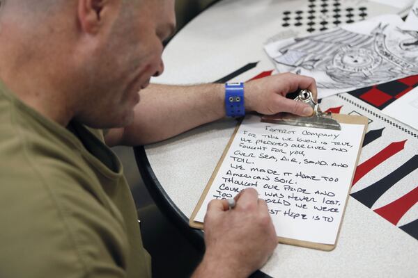 November 20, 2019 - Lawrenceville - Daniel Nickeson writes a poem about the unit. The Gwinnett County jail has designated a new housing unit just for inmates who are military veterans. “The Barracks” is intended to be a therapeutic, 70-bed unit focused on providing the type of support crucial to helping incarcerated veterans make a successful transition back into the community. Bob Andres / robert.andres@ajc.com