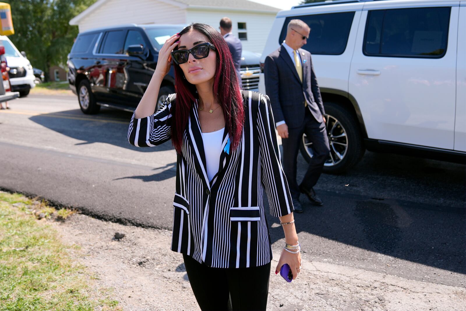 Laura Loomer arrives with Republican presidential nominee former President Donald Trump for a visit to the Shanksville Volunteer Fire Company in Shanksville, Pa., Wednesday, Sept. 11, 2024. (AP Photo/Matt Rourke)