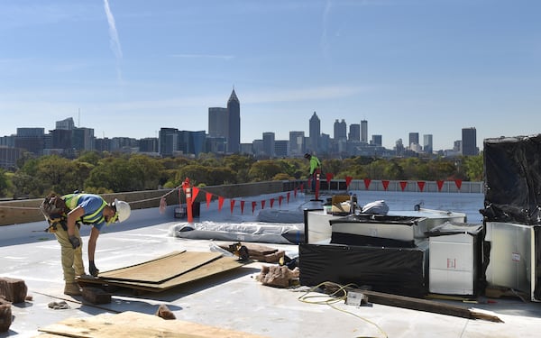 The construction crew works on the rooftop of the T3 West Midtown construction site at Atlantic Station. The development cost — which Hines didn’t disclose — is about 10 percent to 15 percent more than a conventional office building per square foot, according to John Heagy, senior managing director for Hines Southeast Region.