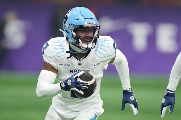 Toronto Argonauts' DaShaun Amos (8) runs back an interception against the Winnipeg Blue Bombers during the second half of a CFL football game at the 111th Grey Cup in Vancouver, British Columbia, Sunday, Nov. 17, 2024. (Frank Gunn/The Canadian Press via AP)