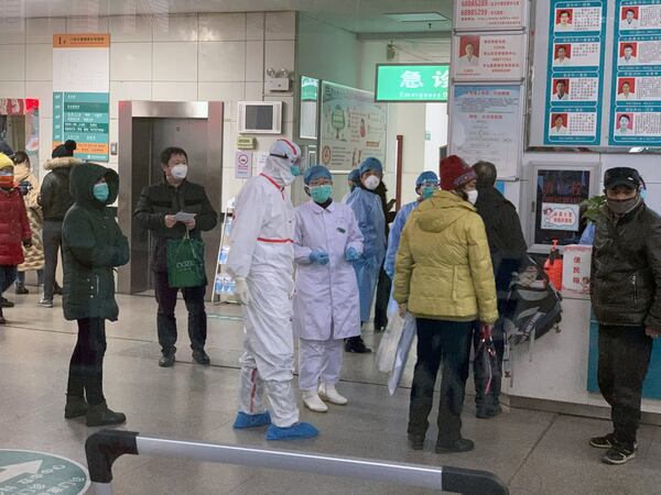 Patients wait to see doctors at No. 9 Hospital in Wuhan, China, on Thursday, Jan. 23, 2020, where the medical staff are all wearing heavily protective clothing. Struggling to contain a deadly virus overwhelming hospitals and fueling fears of a pandemic, China on Thursday sharply expanded travel restrictions to millions more residents in the center of the country where the malady was first reported three weeks ago. (Chris Buckley/The New York Times)