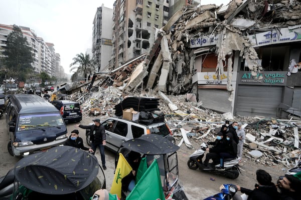 Displaced residents return to Dahiyeh, in Beirut, Lebanon, following a ceasefire between Israel and Hezbollah that went into effect on Wednesday, Nov. 27, 2024. (AP Photo/Bilal Hussein)