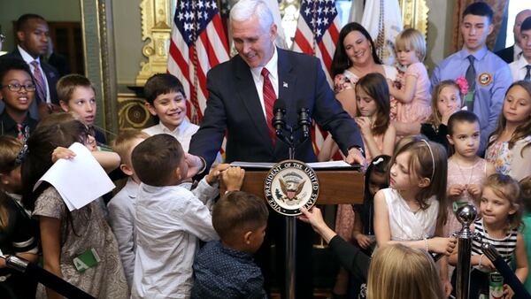 The boy who got bopped in the face, is wearing a white shirt standing to the right, just behind, Vice President Mike Pence after he delivered remarks during an event celebrating National Military Appreciation Month and National Military Spouse Appreciation Day.