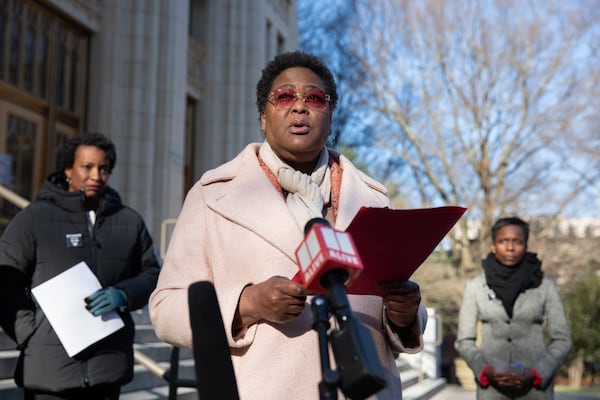 Former City Council President Felicia Moore stands alongside former Inspector General Shannon Manigault (right) and former Governing Board Chair Nichola Hines (left) during a press conference on Feb. 17 ahead of Manigault's resignation from the watchdog office. (Riley Bunch/AJC)