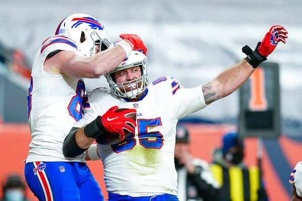 Buffalo Bills tight end Lee Smith (85) celebrates a touchdown against the Denver Broncos during an NFL football game, Saturday, Dec. 19, 2020, in Denver. (AP Photo/Jack Dempsey)