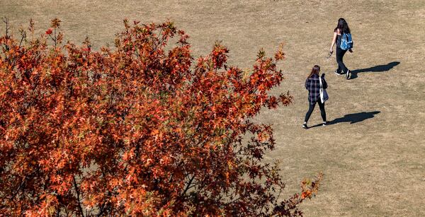 Georgia Tech students make their way across the Tech Green on the Georgia Tech campus on Tuesday, November 7, 2023. (John Spink / John.Spink@ajc.com)

