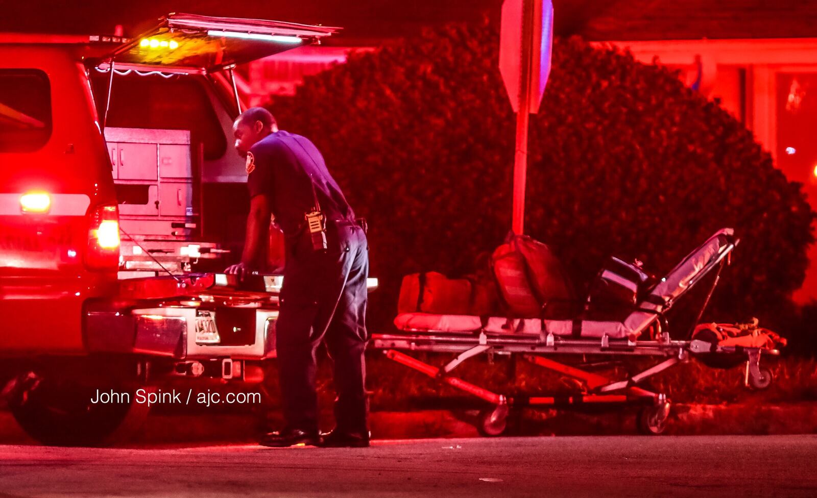 A stretcher is loaded down with gear on the scene of a fatal house fire in the 2400 block of Harvel Drive in northwest Atlanta Tuesday morning. JOHN SPINK / JSPINK@AJC.COM