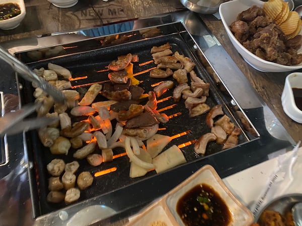 The assorted meats on the grill menu at Gopchang Salon include small intestines, large intestines, hearts, tripe and abomasum (the fourth stomach of a cow). Ligaya Figueras/ligaya.figueras@ajc.com 