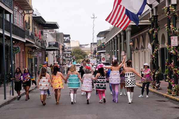 People celebrate on Mardi Gras Day, Tuesday, March 4, 2025 in New Orleans. (AP Photo/Gerald Herbert)