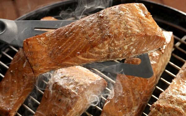 Grilling with indirect heat means the fish can be on the grill a little longer to absorb maximum smoke without burning or drying out. (Michael Tercha/Chicago Tribune/TNS)