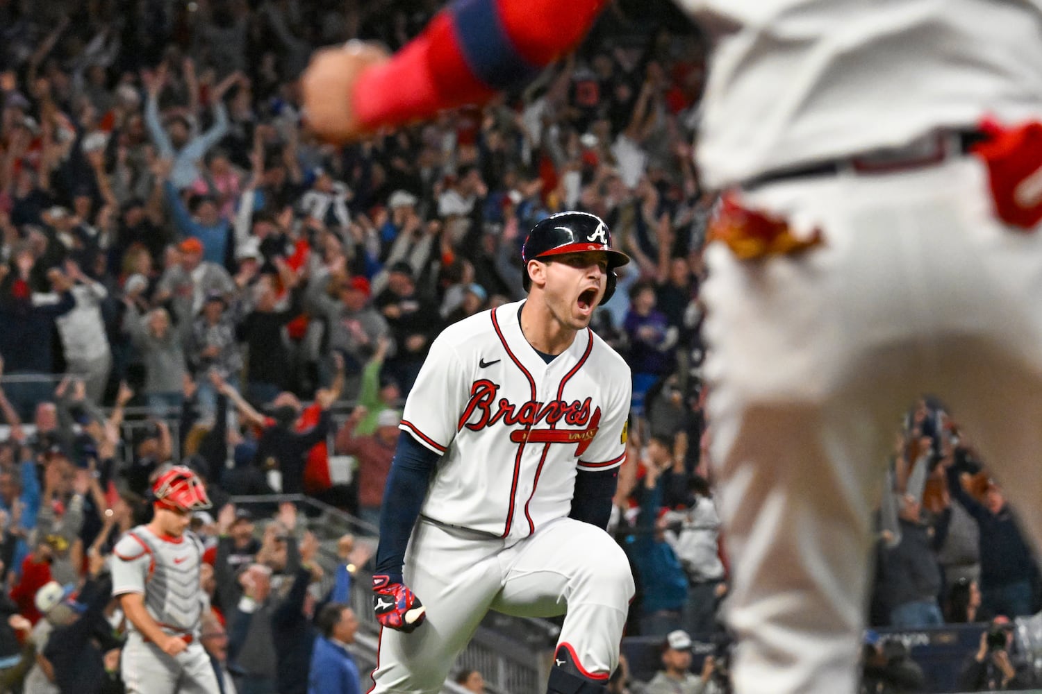 Atlanta Braves’ Austin Riley (27) celebrates a two-run home run against the Philadelphia Phillies during the eighth inning of NLDS Game 2 in Atlanta on Monday, Oct. 9, 2023.   (Hyosub Shin / Hyosub.Shin@ajc.com)