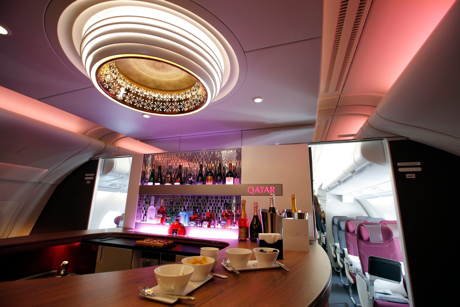 Interior view of the lounge bar in the second floor deck of the Airbus A380 of Qatar Airways presented at the Paris Air Show, in Le Bourget airport, north of Paris, Wednesday, June 17, 2015. Qatar Airways has brought 4 Airbus A380's in service since last year. (AP Photo/Francois Mori)