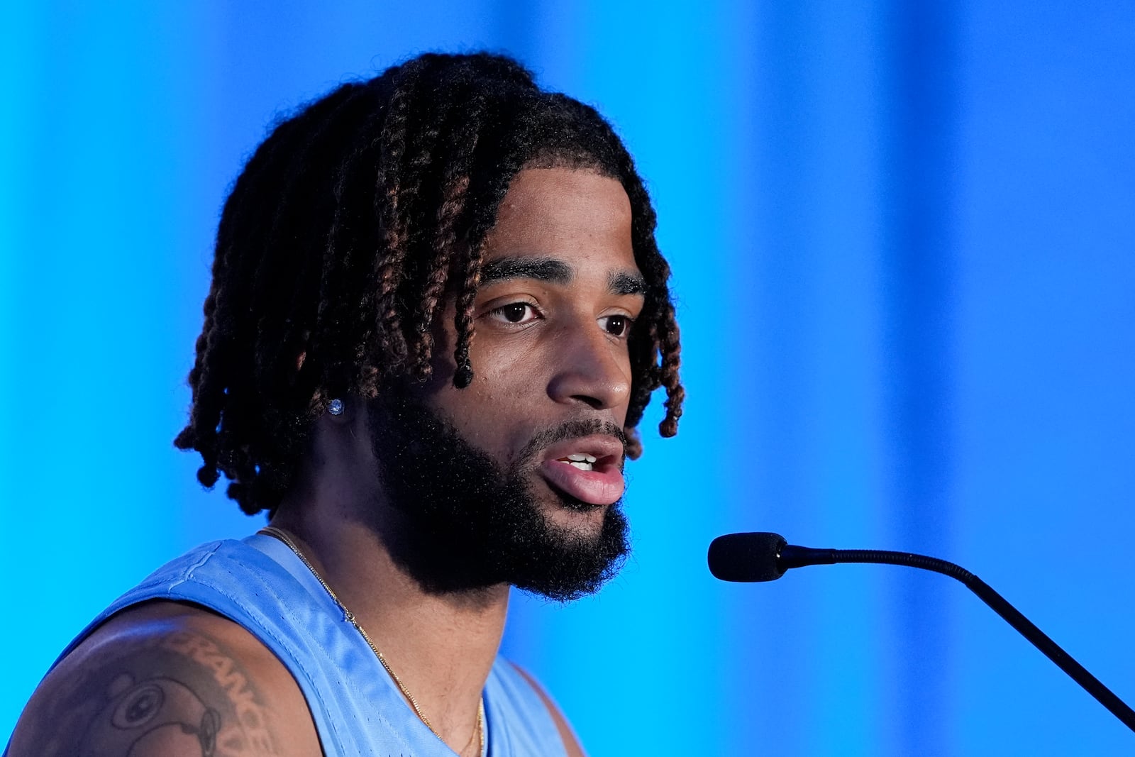 North Carolina guard RJ Davis speaks during a ACC men's NCAA college basketball media day, Thursday, Oct. 10, 2024, in Charlotte, N.C. (AP Photo/Chris Carlson)