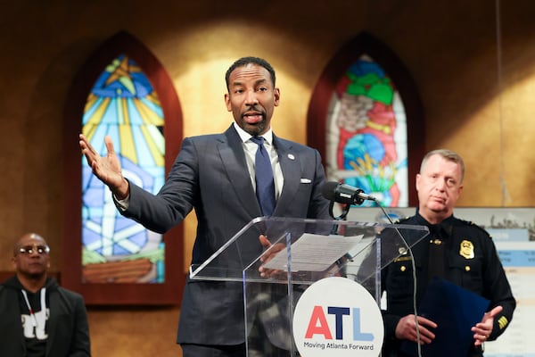 Atlanta Mayor Andre Dickens speaks to members of the media during a press conference next to Atlanta Police Department Chief Darin Schierbaum, right, to discuss reduced crime rate in Atlanta at Salem Bible Church, Thursday, Jan. 4 in Atlanta. (Jason Getz / Jason.Getz@ajc.com)