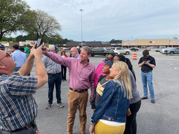 Gov. Brian Kemp, shown greeting supporters in Sandersville, has not fired back publicly at former President Donald Trump, who blames the governor for his 2020 defeat in Georgia and is now backing former U.S. Sen. David Perdue in his race against Kemp. But Kemp also downplayed Trump's recent donation of $500,000 to a pro-Perdue group. “It hasn’t moved the needle here,” he said during his stop in Sandersville. “But we can’t control that. We’re staying on our message of reminding people I’ve done exactly what I said I’d do.”