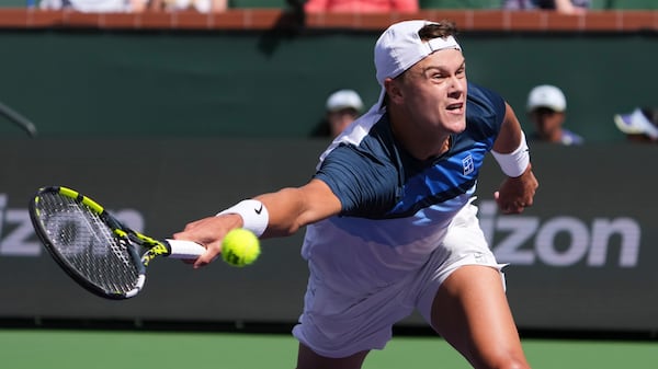 Holger Rune, of Denmark, returns to Jack Draper, of Great Britain, during the final match at the BNP Paribas Open tennis tournament Sunday, March 16, 2025, in Indian Wells, Calif. (AP Photo/Mark J. Terrill)