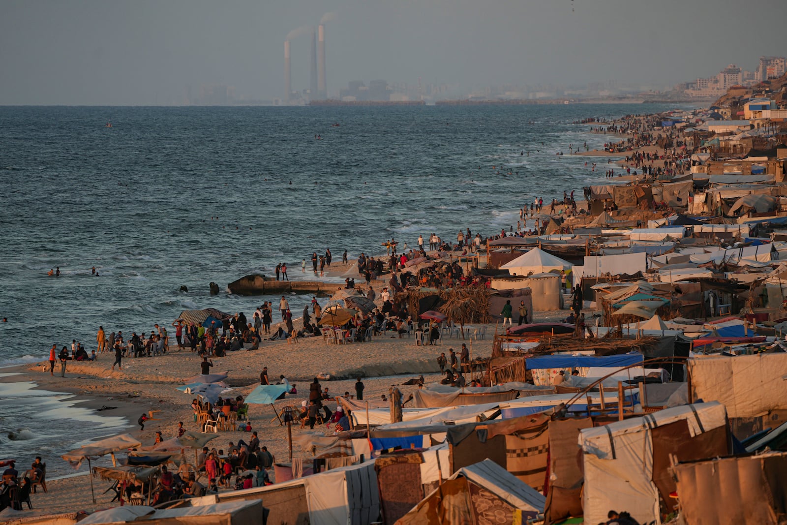 Tents are crammed together as displaced Palestinians camp along the beach of Deir al-Balah, central Gaza Strip, Wednesday, Oct. 9, 2024. (AP Photo/Abdel Kareem Hana)