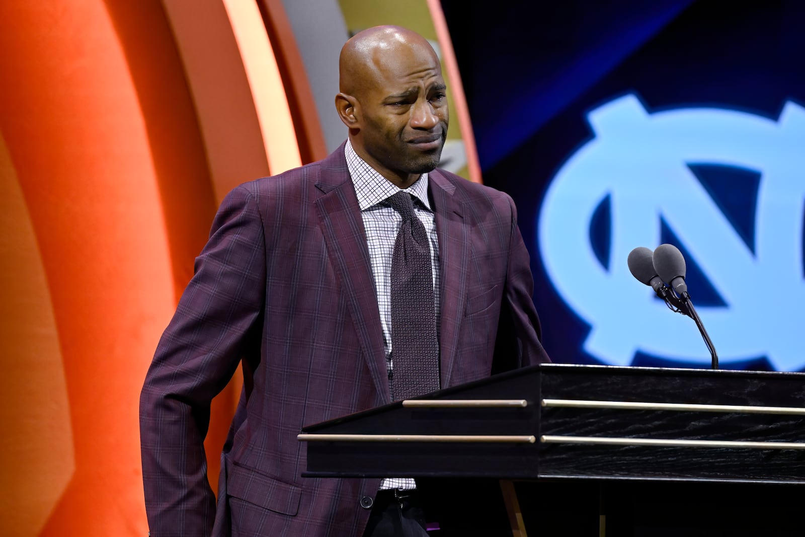 Vince Carter reacts while talking about his mother during his enshrinement in the Basketball Hall of Fame, Sunday Oct. 13, 2024, in Springfield, Mass. (AP Photo/Jessica Hill)