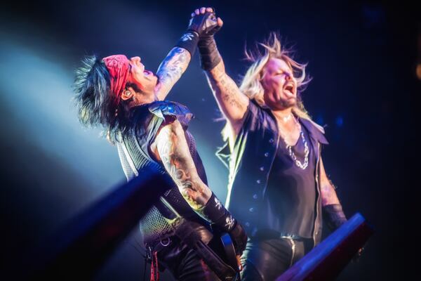 Nikki Sixx and Vince Neil share a moment. Photo: Dustin Jack.