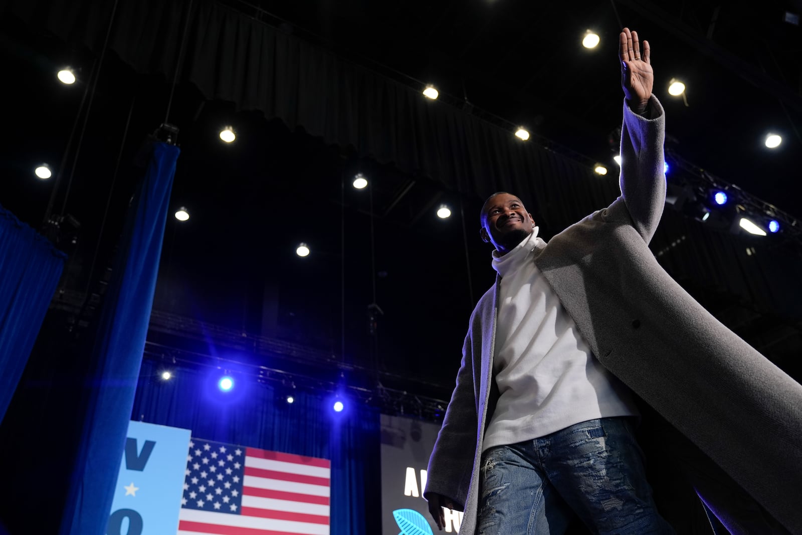 Grammy winning artist, Usher, waves to the crowd as he walks on stage during a campaign event for Democratic presidential nominee Vice President Kamala Harris at Lakewood Amphitheatre, Saturday, Oct. 19, 2024, in Atlanta. (AP Photo/Jacquelyn Martin)