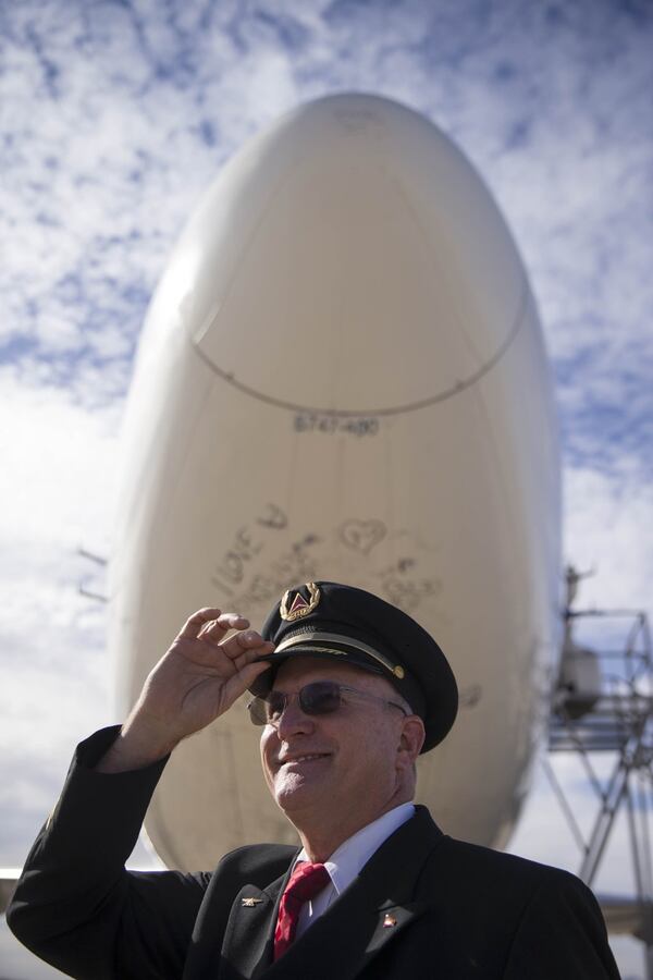 01/03/2018 — Marana, AZ, - Delta pilot Paul Galahan poses for a portrait with the Delta “Queen of the Skies” 747 airplane at PinalAirpark in Marana, Arizona, Wednesday, January 3, 2018. After a tour across the United Staes, the Delta “Queen of the Skies” 747 airplane was retired on Wednesday. The plane was flown to PinalAirpark in Marana, Arizona, where it joined other 747 Delta airplanes that had been retired. The planes last flight pattern was guided by Delta pilots Steve Hanlon and Paul Galahan. ALYSSA POINTER/ALYSSA.POINTER@AJC.COM