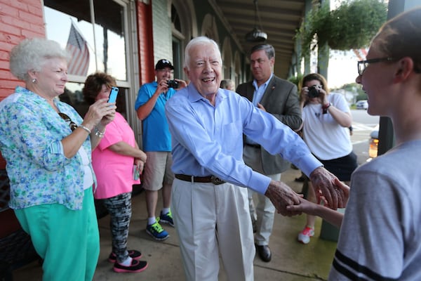 President Jimmy Carter shakes hands as he arrives at a birthday party for his wife Rosalynn in 2015 in Plains, Georgia. (Ben Gray/The Atlanta Journal-Constitution/TNS)