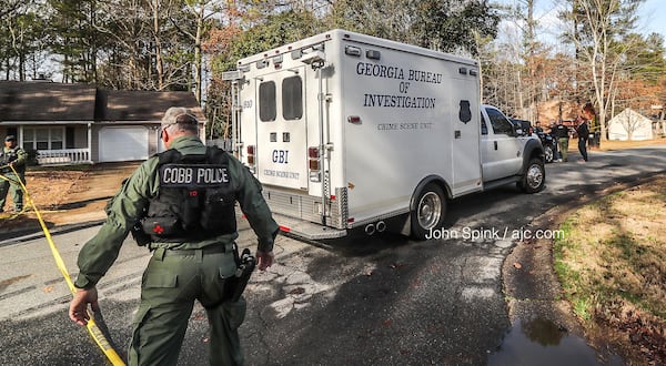 Cobb County police officers and GBI agents were expected to remain in the Mill Chase subdivision throughout the day Thursday to investigate.