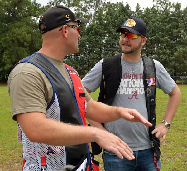 Sgt. Will Hinton, left, talks with Ledger-Enquirer reporter Kelby Hutchison prior to shooting trap at Ft. Moore. (Photo Courtesy of Darrell Roaden/Ledger-Enquirer)