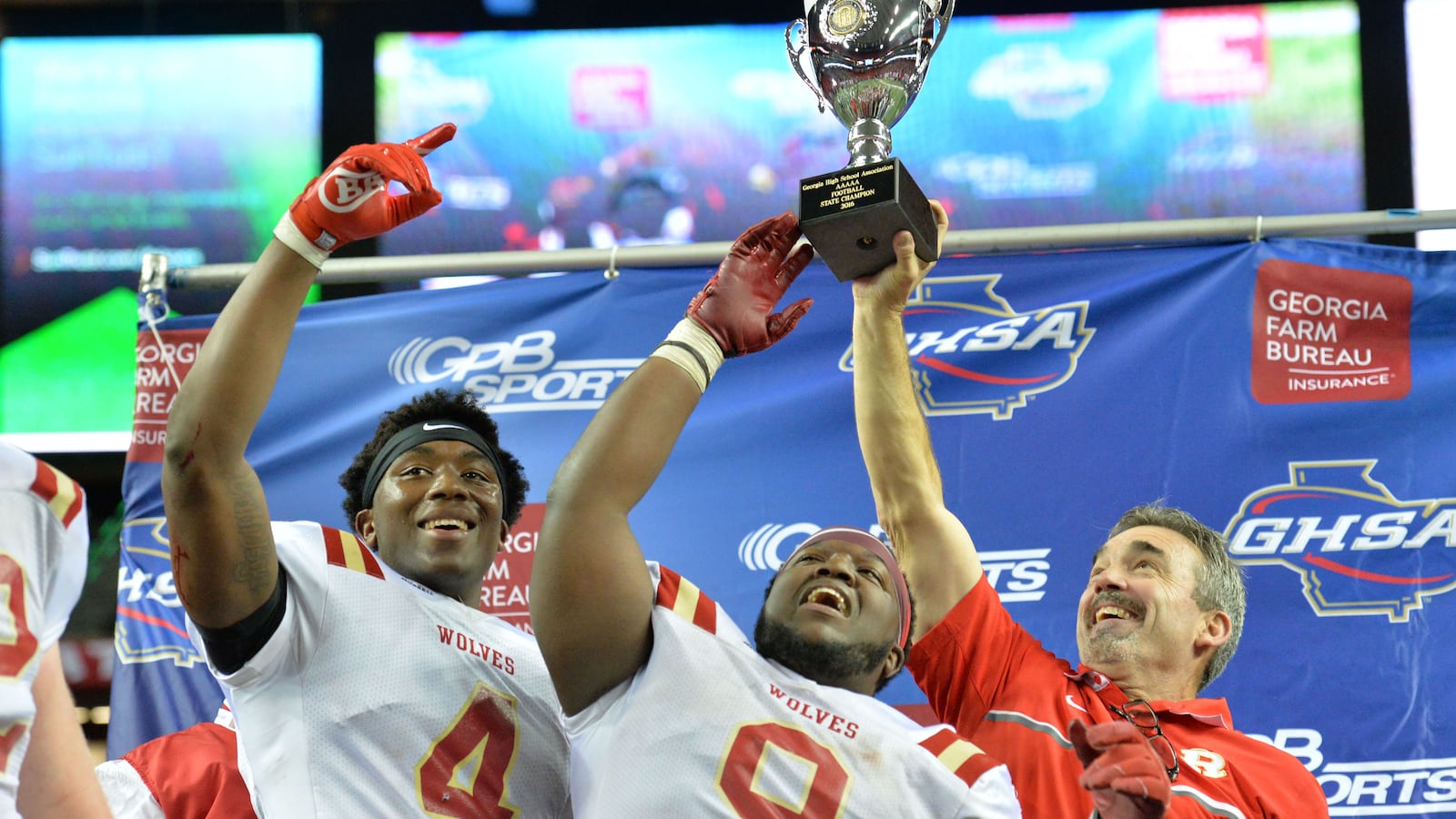 Head coach John Reid (right) led the Rome Wolves to a Class AAAAA state championship in 2016. (Hyosub Shin/hshin@ajc.com)