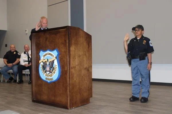 Cobb Public Safety Director Michael Register swears in 10-year-old Arya Patel arrived at the Cobb Police Training Academy Friday, May 17. (Photo Courtesy of Jake Busch)